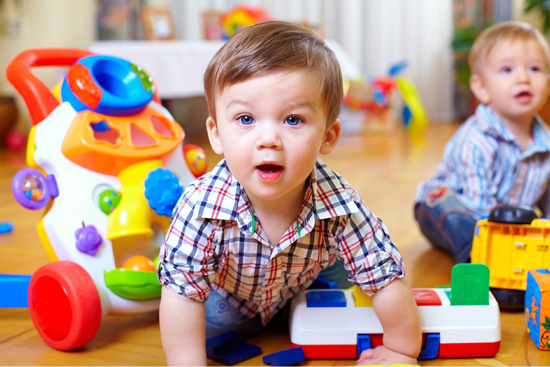 Two boys playing with toys